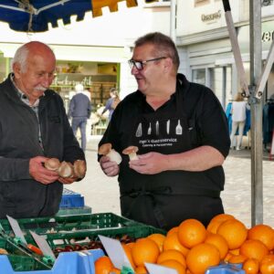 Men Holding Mushrooms